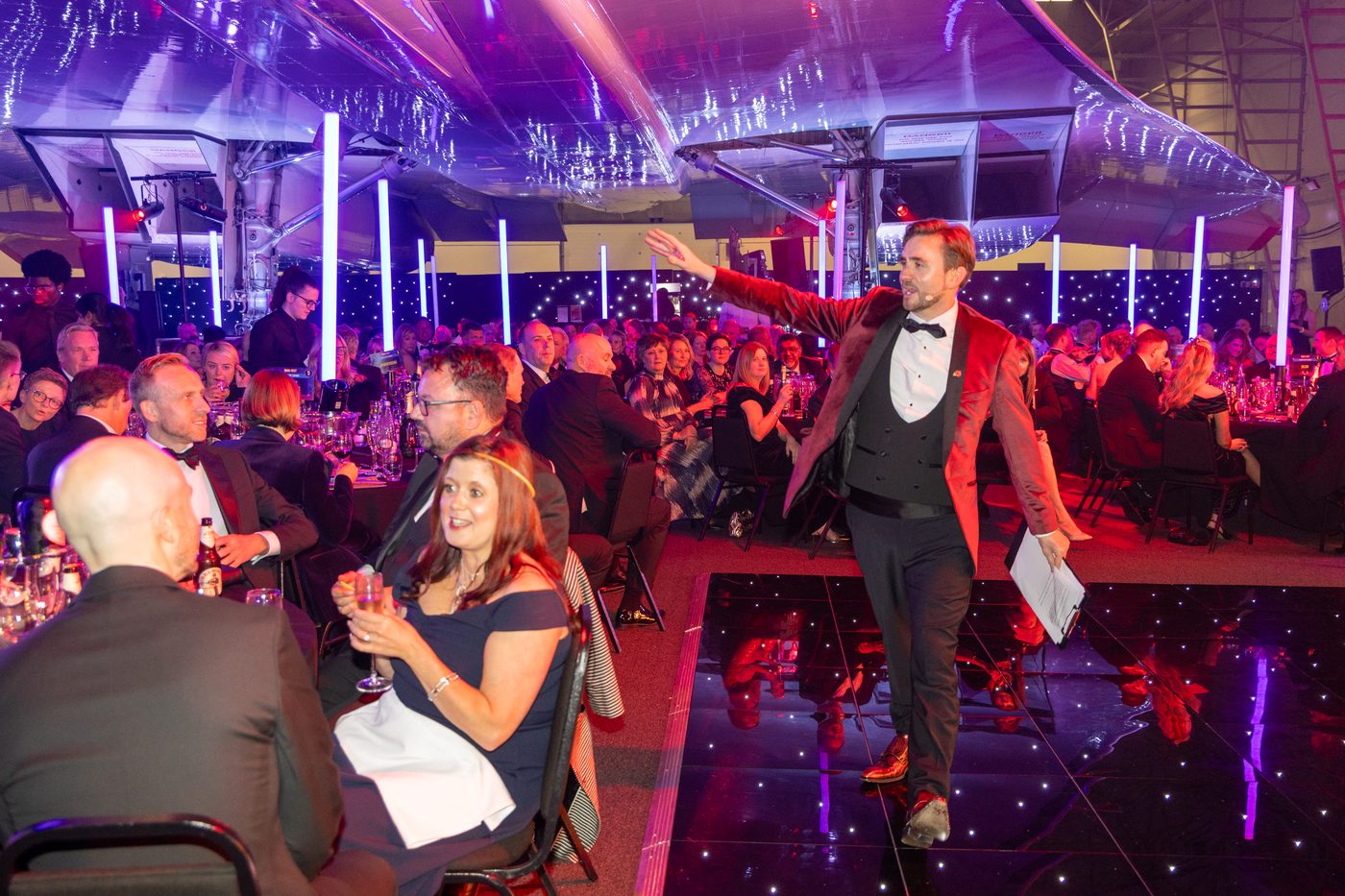 Kevin Durham taking a bid from the tables during the MAG Charity Ball live auction
