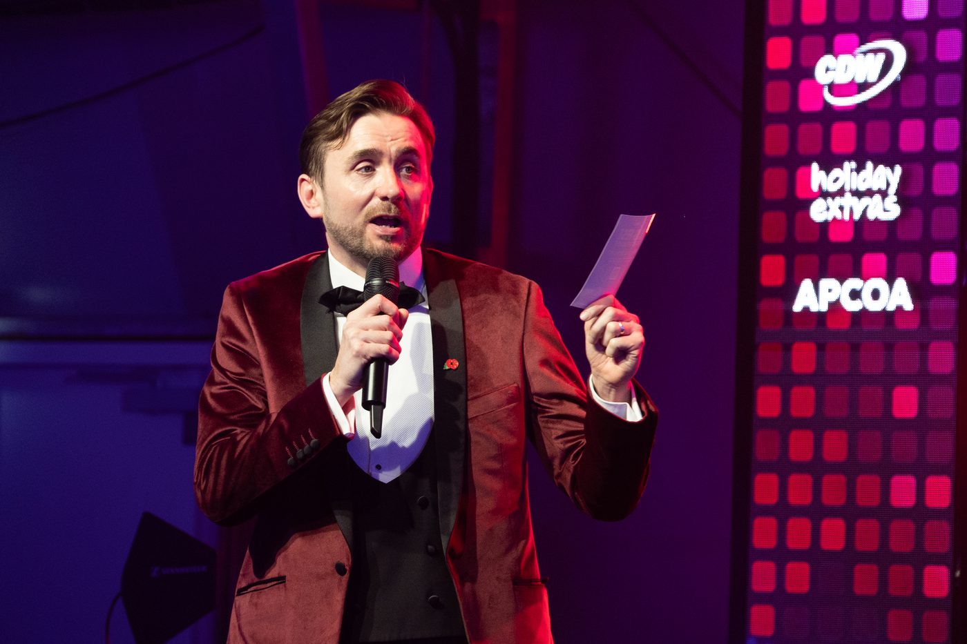 Kevin Durham hosting the MAG Charity Ball from the stage